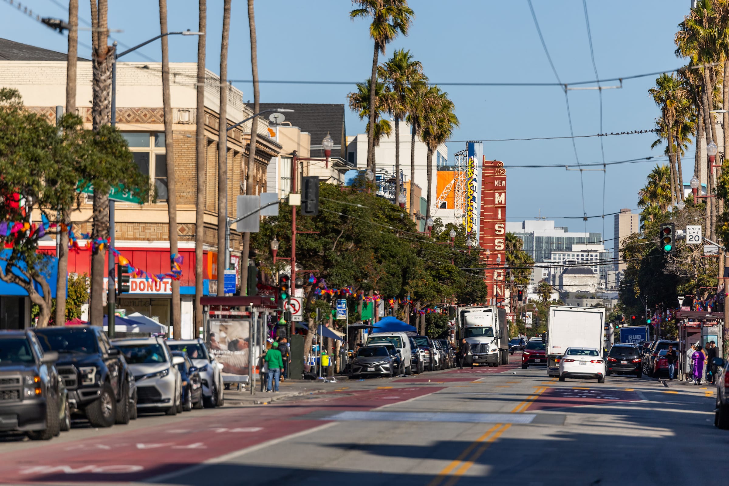 Street-level view of Mission District, San Francisco with New Mission sign