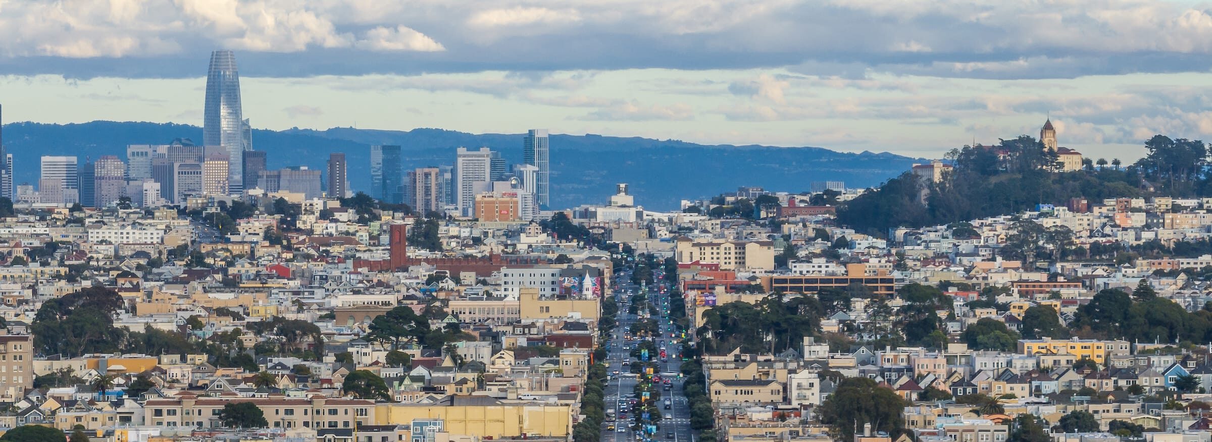 Low aerial view of Richmond District and San Francisco skyline